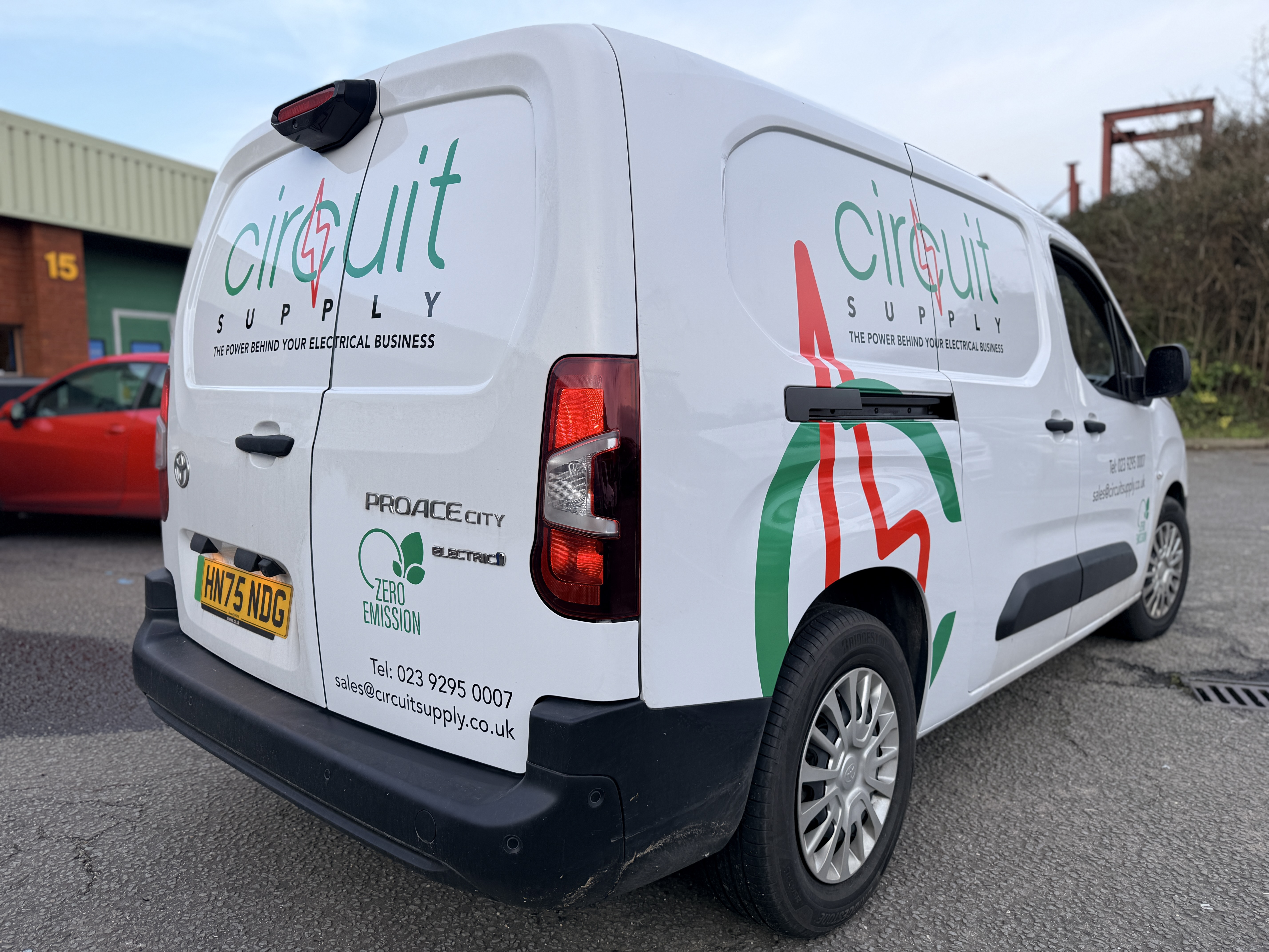 Rear graphics on a commercial van featuring full-colour printed branding.